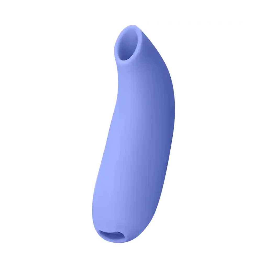 A purple silicone suction stimulator with an opening at the top and bottom.