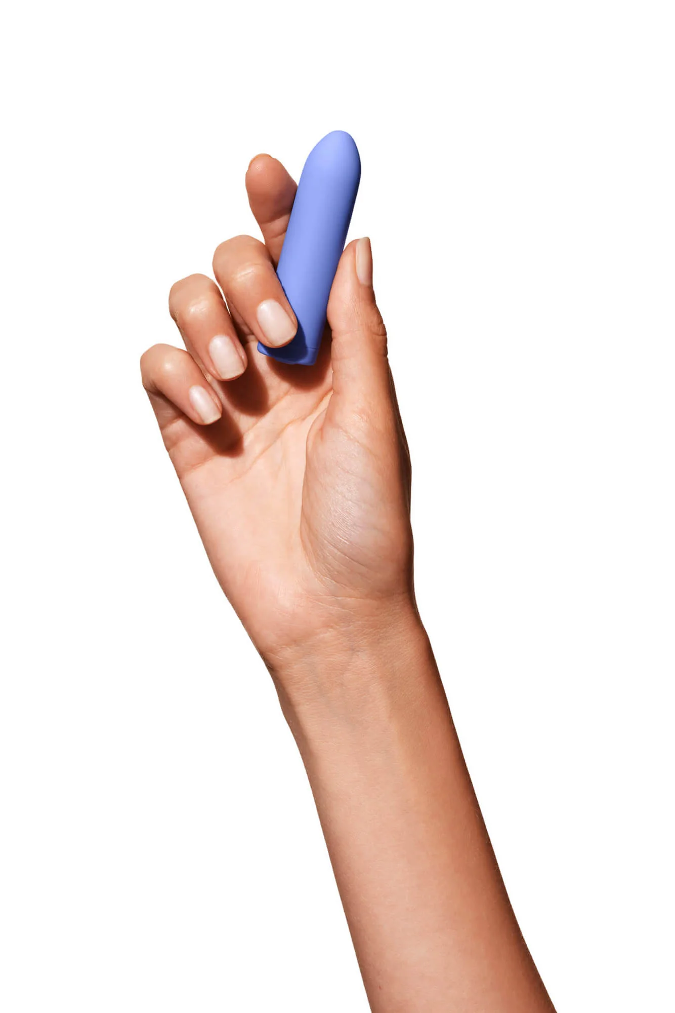 A hand holds a periwinkle bullet vibrator.