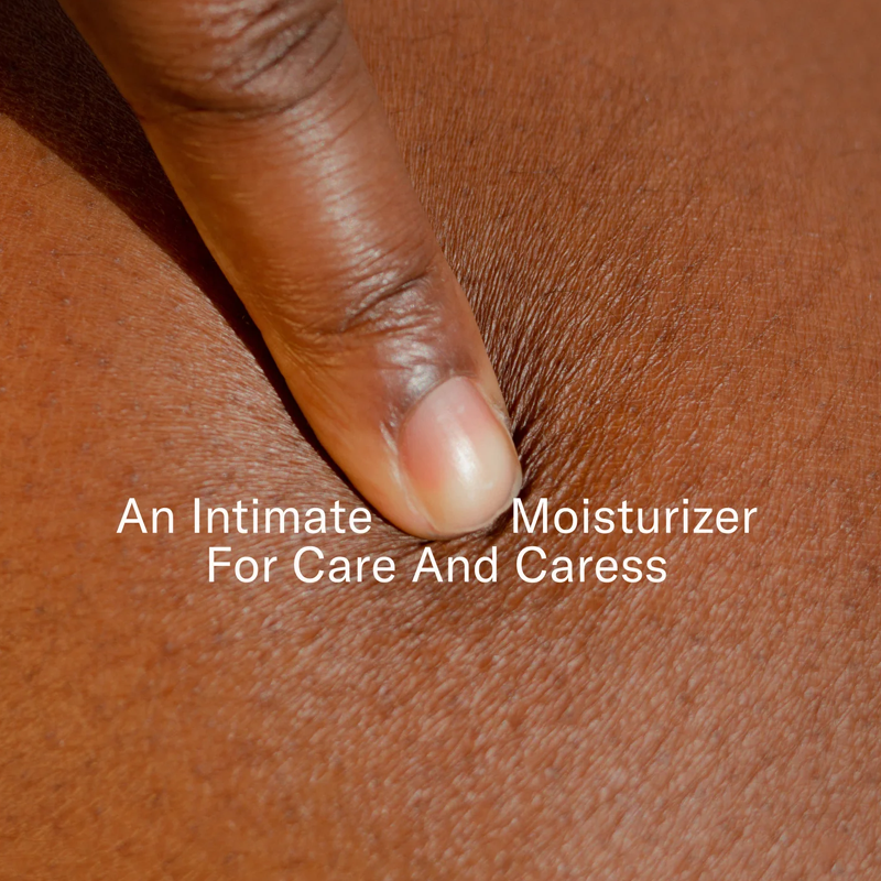A finger presses into skin with text overlay "An Intimate Moisturizer For Care And Caress".