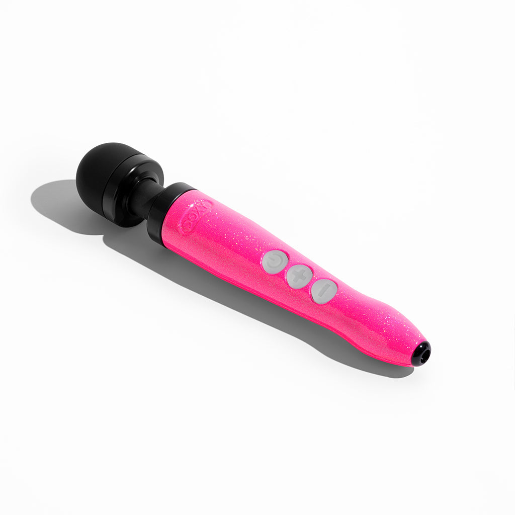Pink glitter wand massager with black head and three grey buttons.