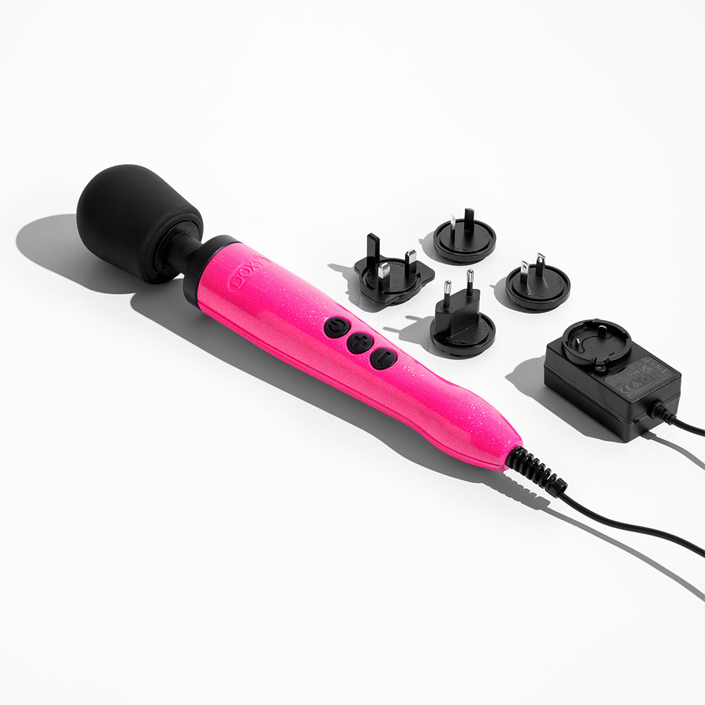 Hot pink Doxy wand massager with power adapter and interchangeable plugs.