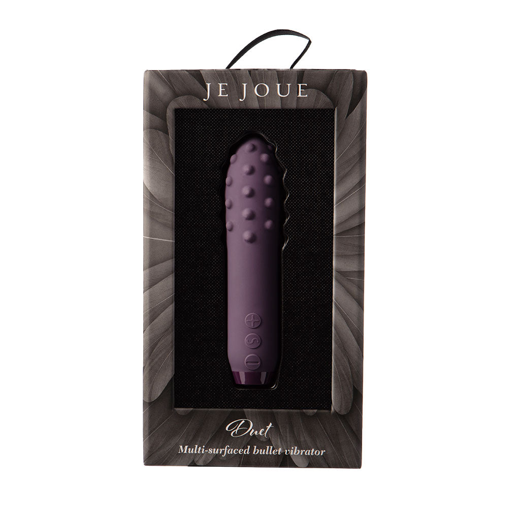 Purple Je Joue Duet bullet vibrator in packaging with textured surface.