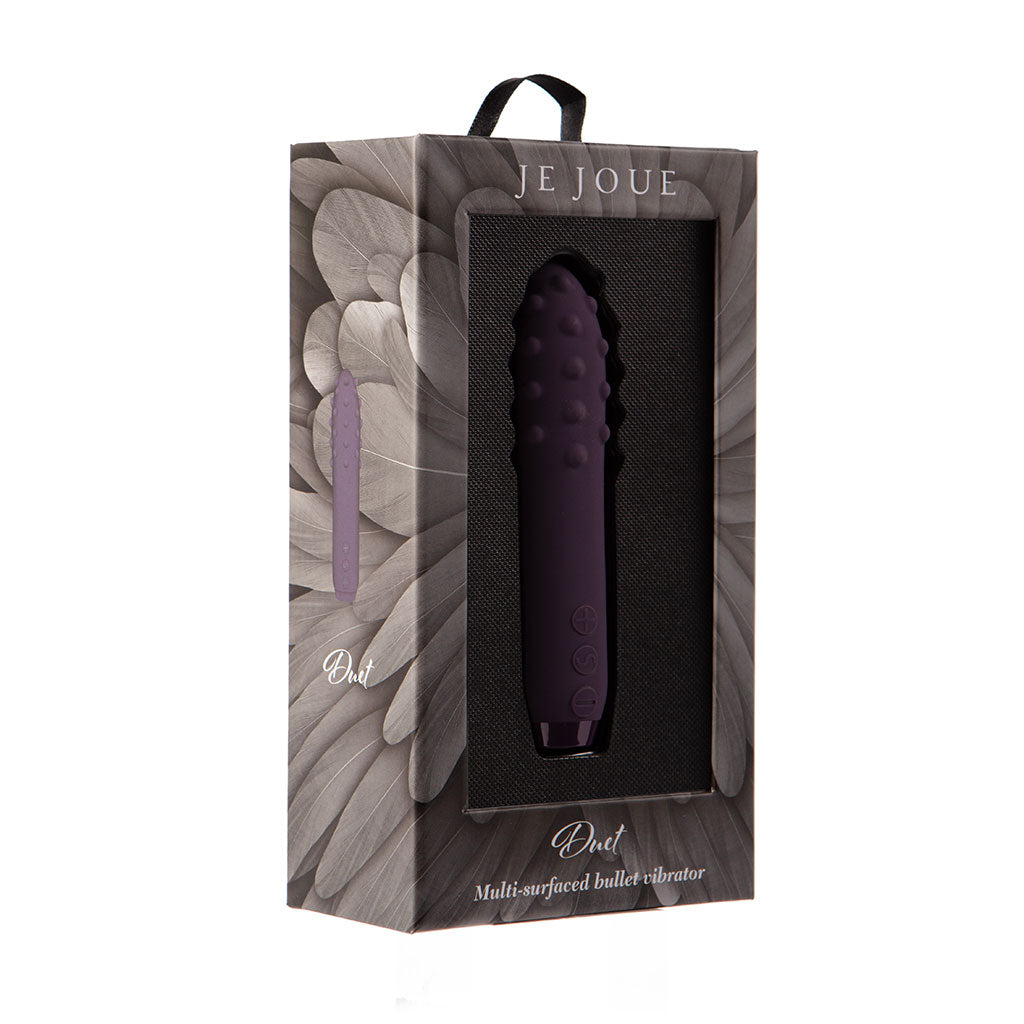 Purple Je Joue Duet bullet vibrator in its packaging.