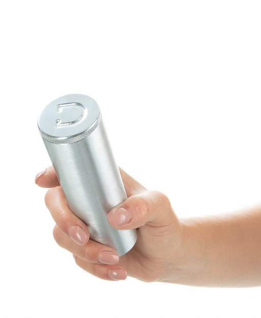 Hand holding a ribbed aluminum butt plug with a D logo.