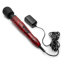 A black and red rose patterned wand massager with a black head and charging accessories.