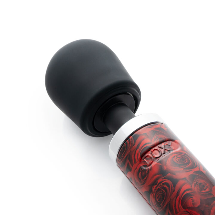 A Doxy wand massager with a black head and a red rose pattern on the handle.