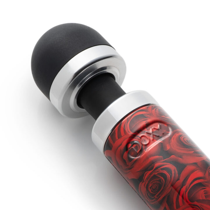 Compact wand massager with a black silicone head and a rose-patterned body.