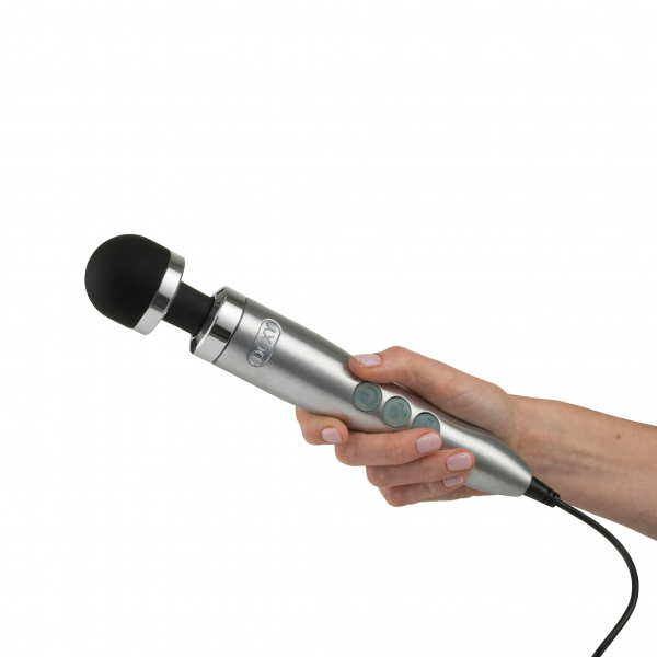 A hand holds a silver Doxy wand massager with a black head.