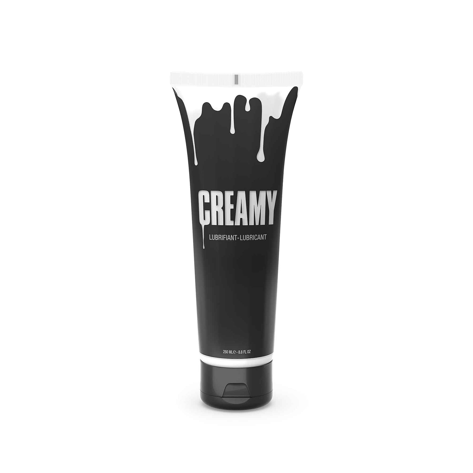 A black tube of Creamy lubricant with white dripping paint design.