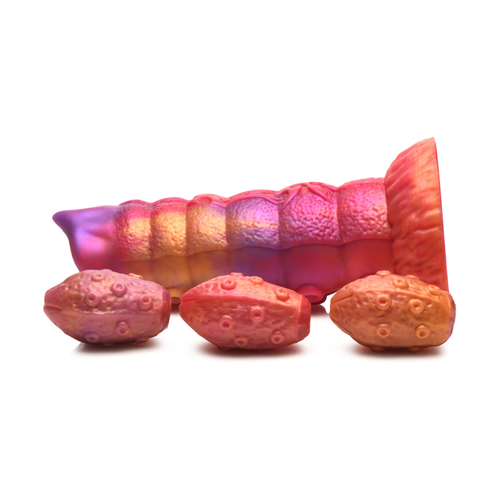 Pink and purple segmented dildo with three textured eggs.