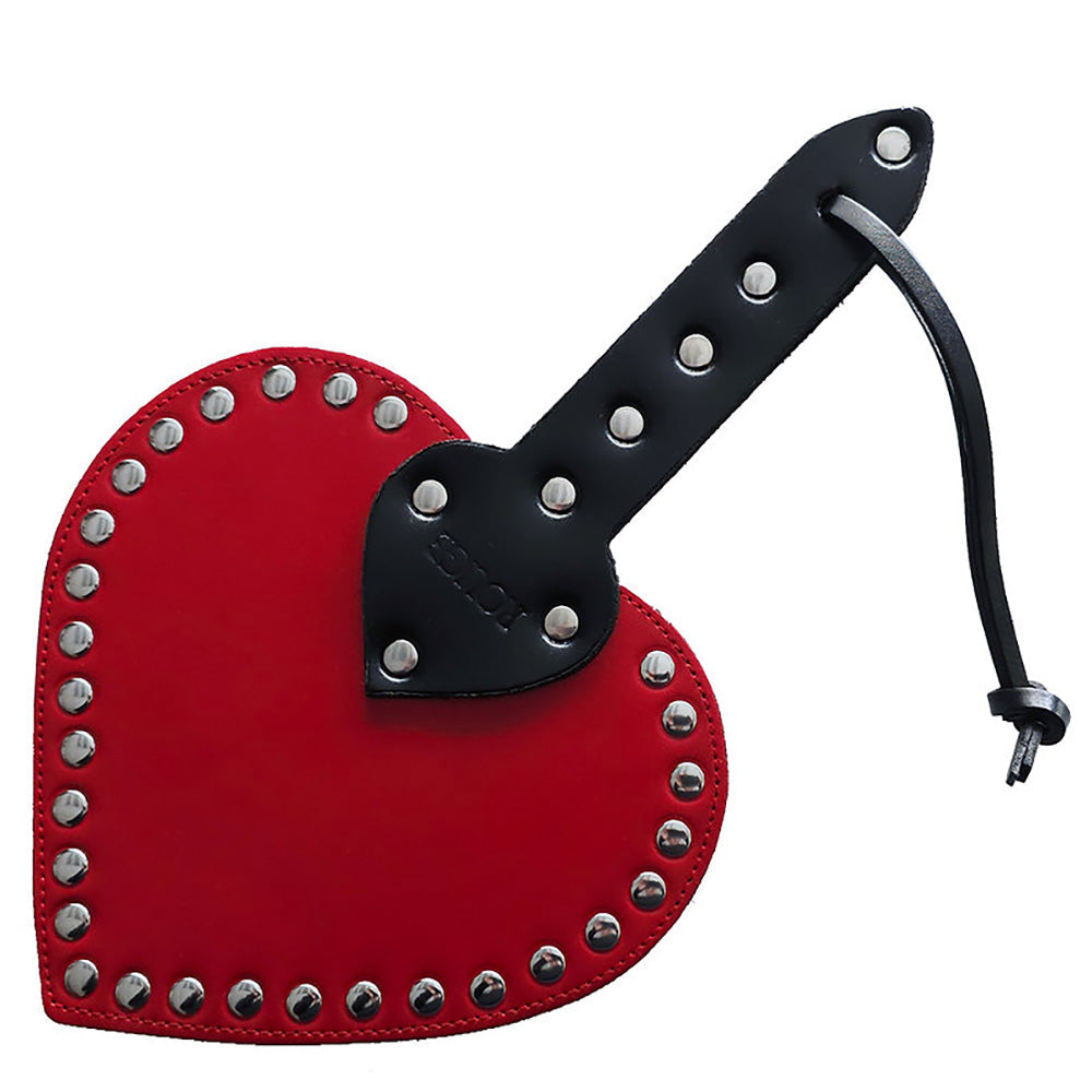 Red heart-shaped leather paddle with a studded edge and black handle.