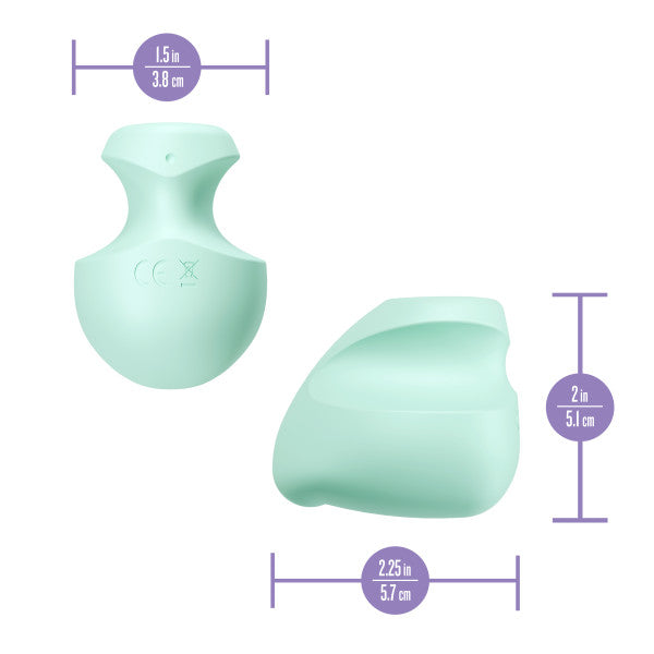 A mint green silicone vibrator with dimensions indicated.