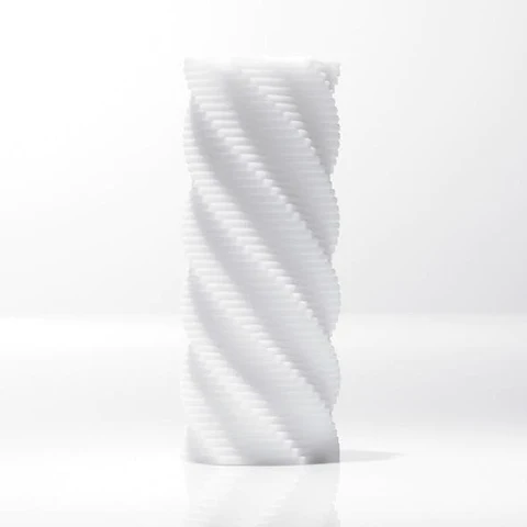 A white, textured candle with a spiral design.
