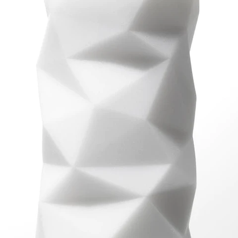 A white reusable male masturbator with a textured polygonal surface.