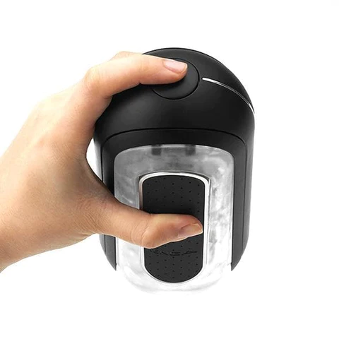 Tenga Flip Zero EV Black rechargeable vibrating stroker held by a hand.