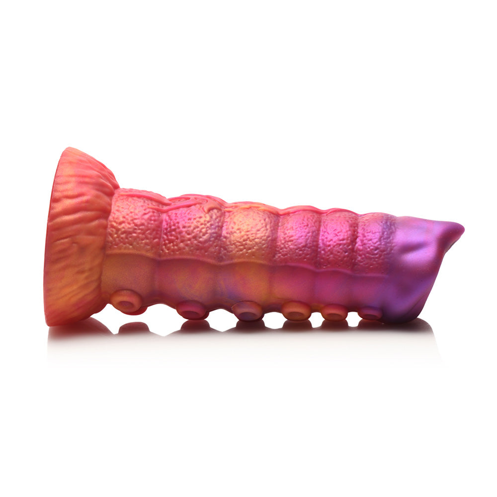 Segmented pink and purple silicone dildo with a flared base.
