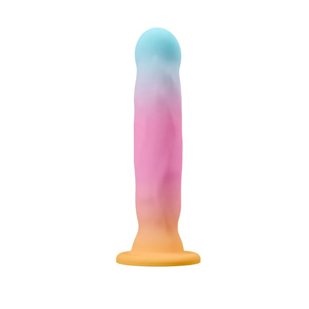A silicone stimulator with a gradient of blue, pink, and orange.