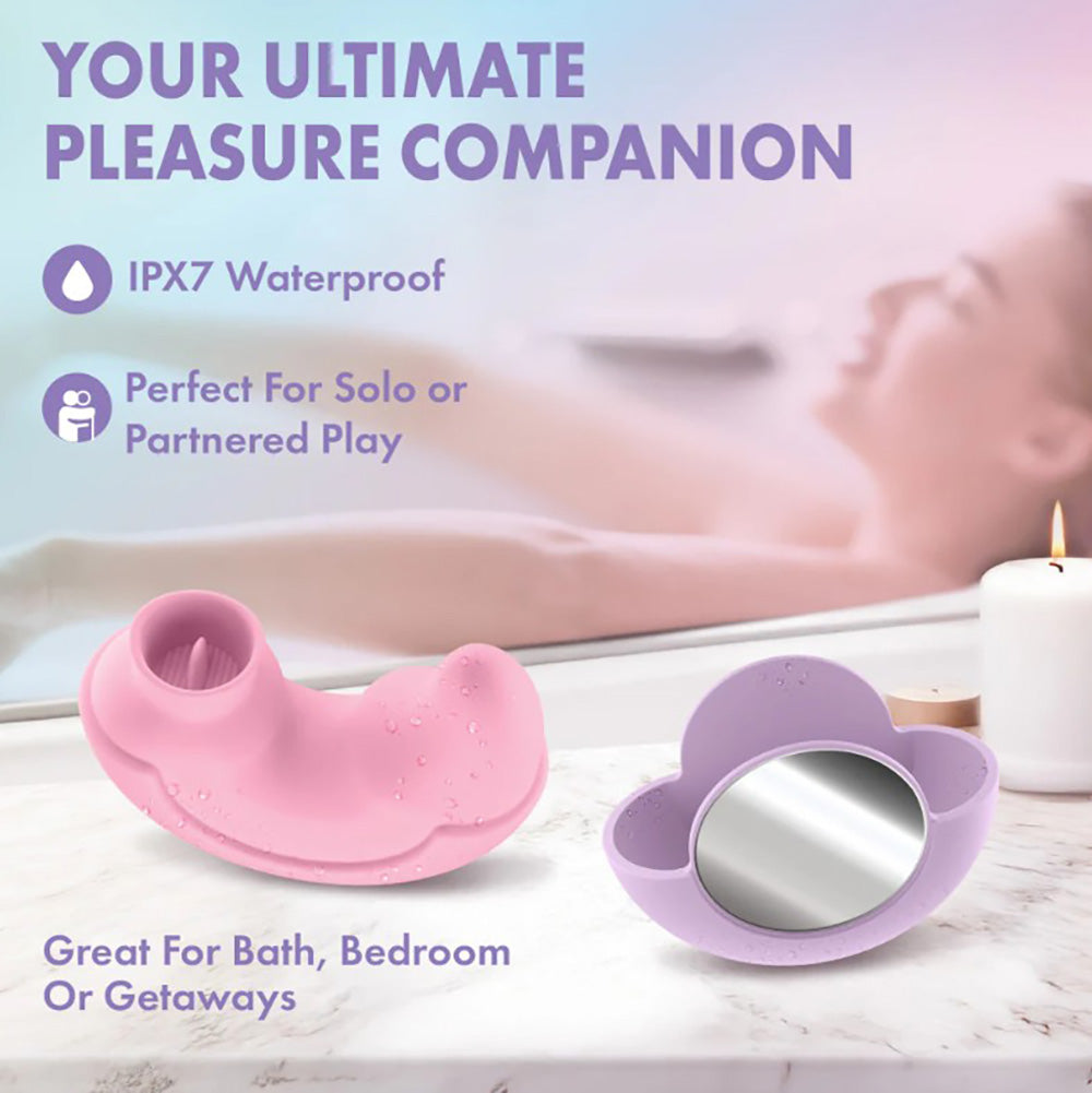 A pink dual-ended vibrator and a purple holder with a mirror.