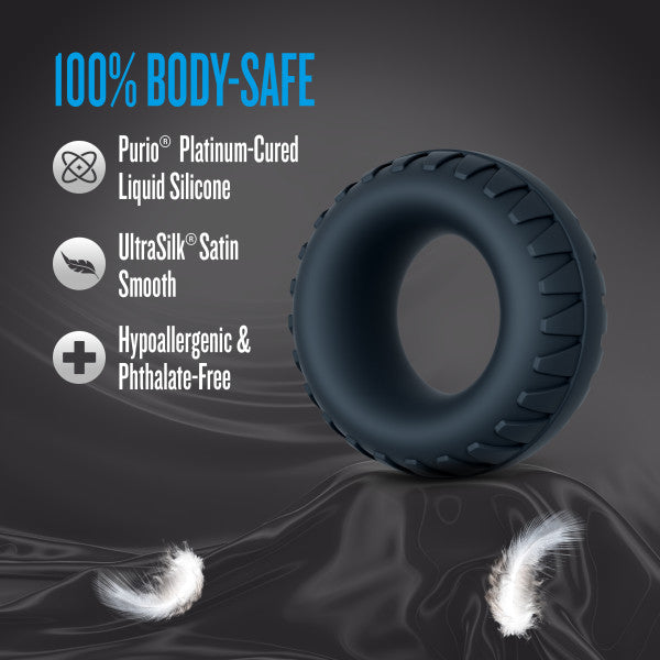 A dark grey textured silicone cock ring and ball stretcher.