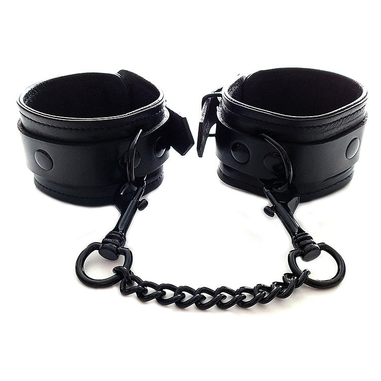 Black leather wrist cuffs with a connecting chain.