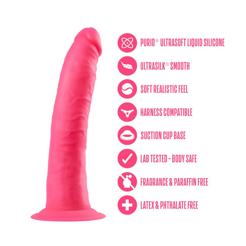 Neon pink dual density silicone dildo with suction cup base and harness compatibility.