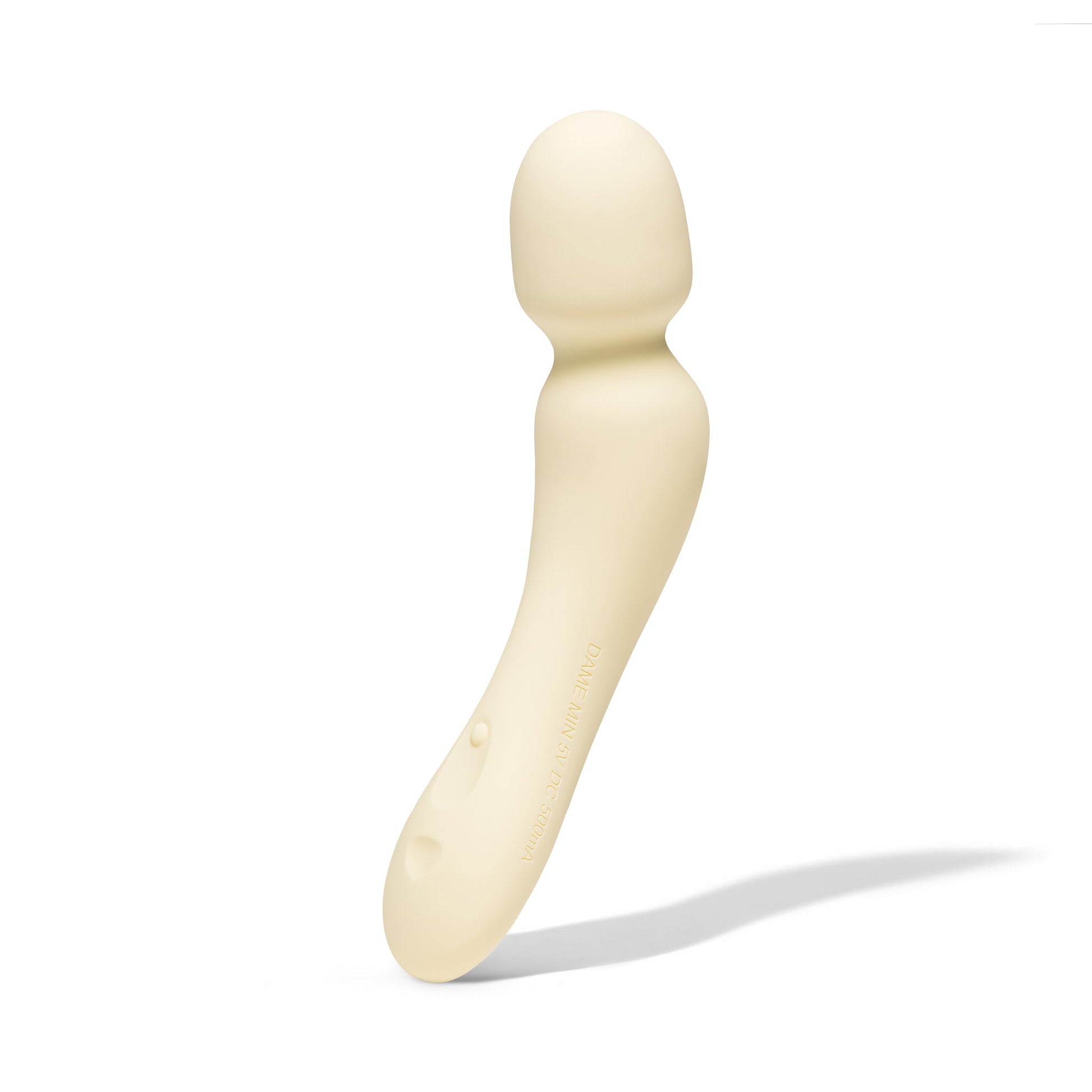 A beige, curved wand vibrator with text on the side.