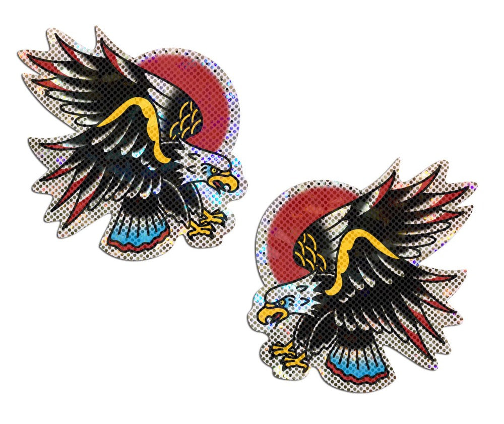 Two glitter pasties featuring a traditional tattoo-style eagle with a red sun.