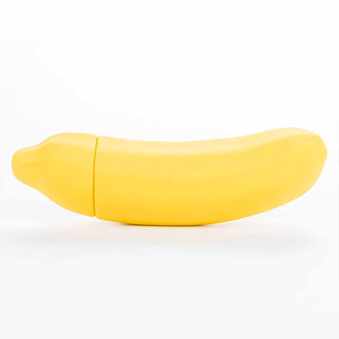 Yellow banana-shaped vibrator with a seam down the middle.