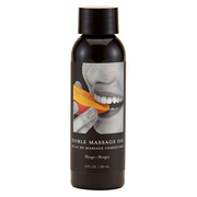A bottle of Mango Edible Massage Oil with a black cap and label showing a mouth biting a mango slice.