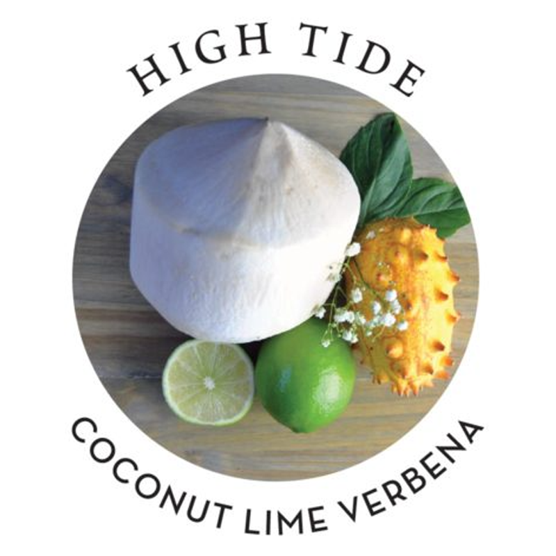 Coconut, lime, and kiwano fruit with leaves and flowers.