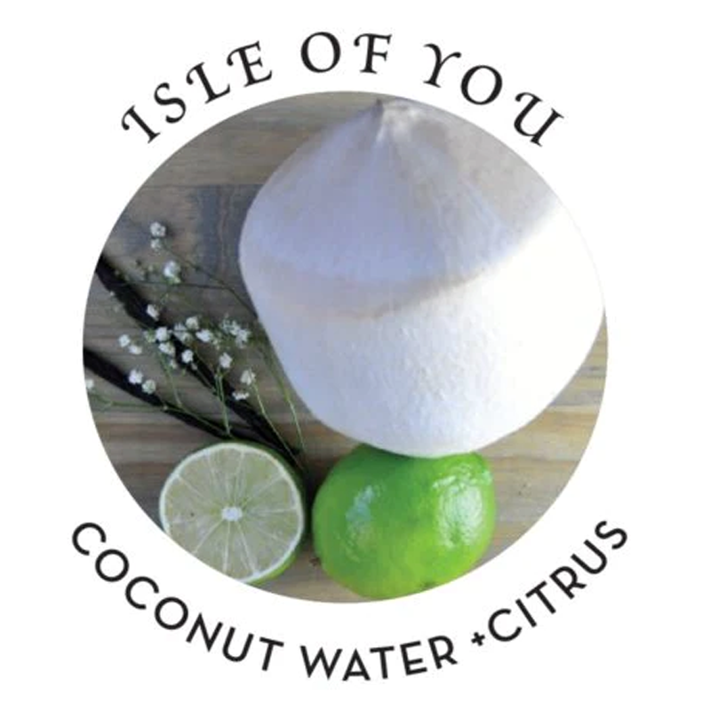 A white coconut with limes and text that reads "ISLE OF YOU COCONUT WATER CITRUS".