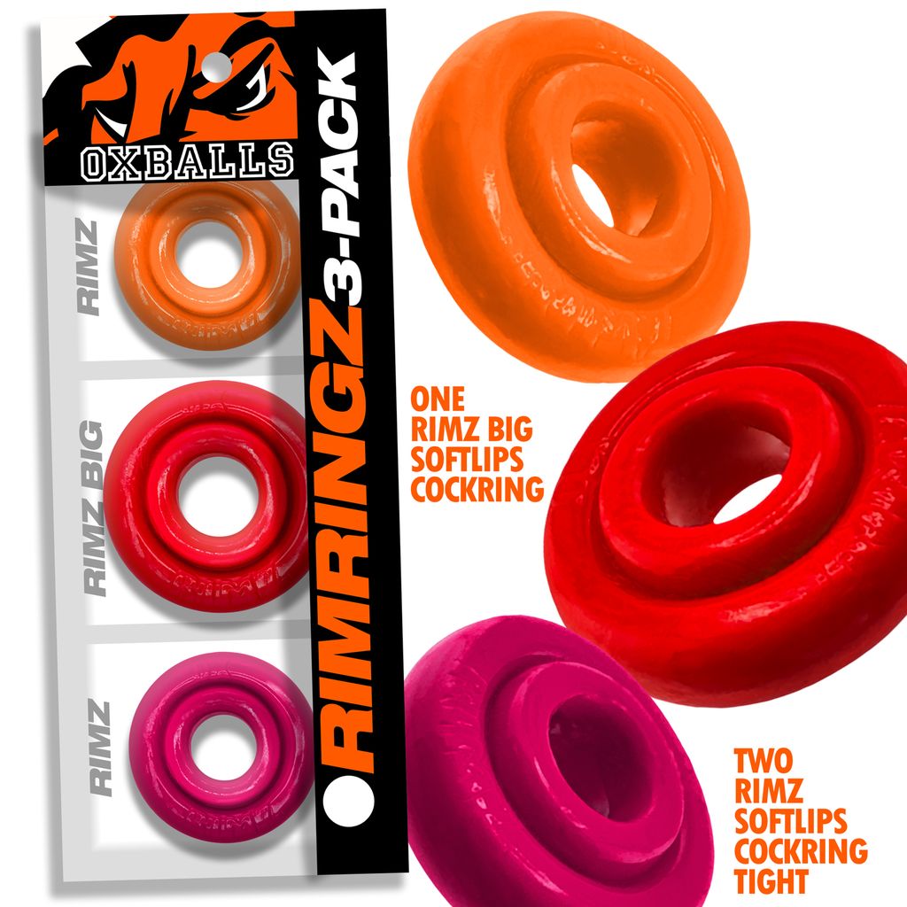 Three silicone cock rings in orange, red, and pink.