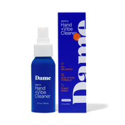 A blue spray bottle and box of Dame Gentle Hand + Vibe Cleaner with sweet orange.