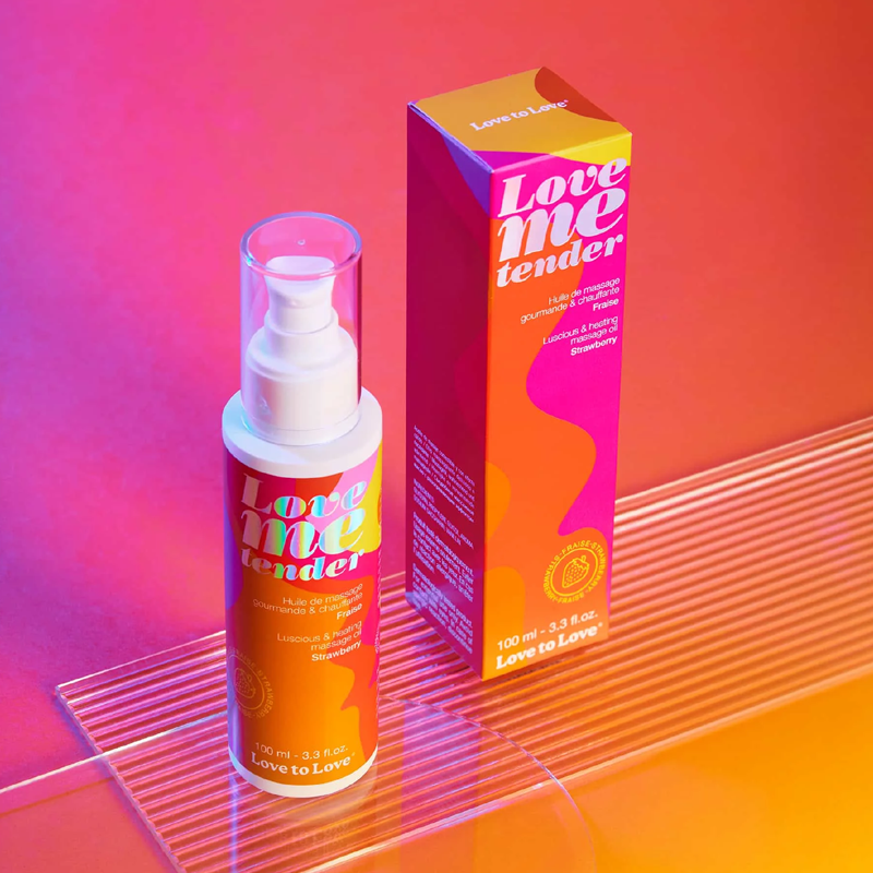 Love to Love strawberry warming massage oil bottle and box.