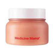 Medicine Mama exfoliating sugar scrub in a pink jar with a white lid.