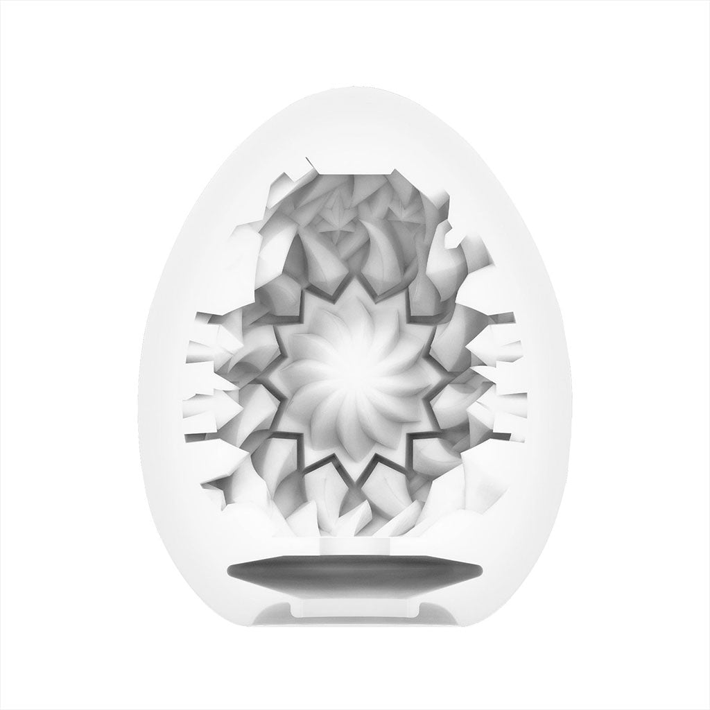 Shiny II Male Masturbator Egg with a sun-shaped internal design.