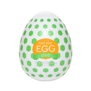 Tenga EGG Stud textured male masturbator with green hexagonal pattern.
