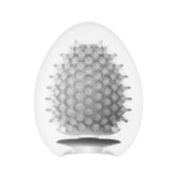 White egg-shaped male masturbator with textured studs.