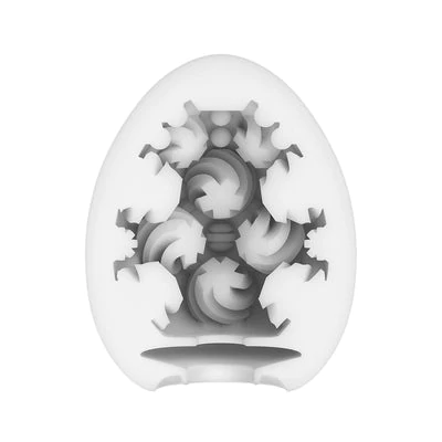 Tenga Curl Textured Male Masturbator Egg with TPE sleeve.