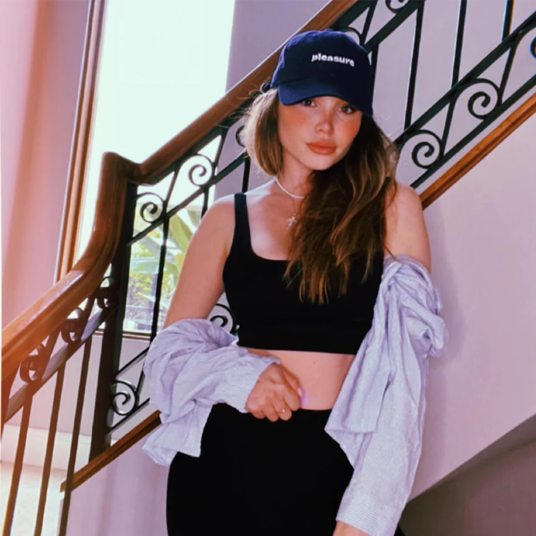 Navy blue cotton dad hat with "pleasure" embroidered on the front.