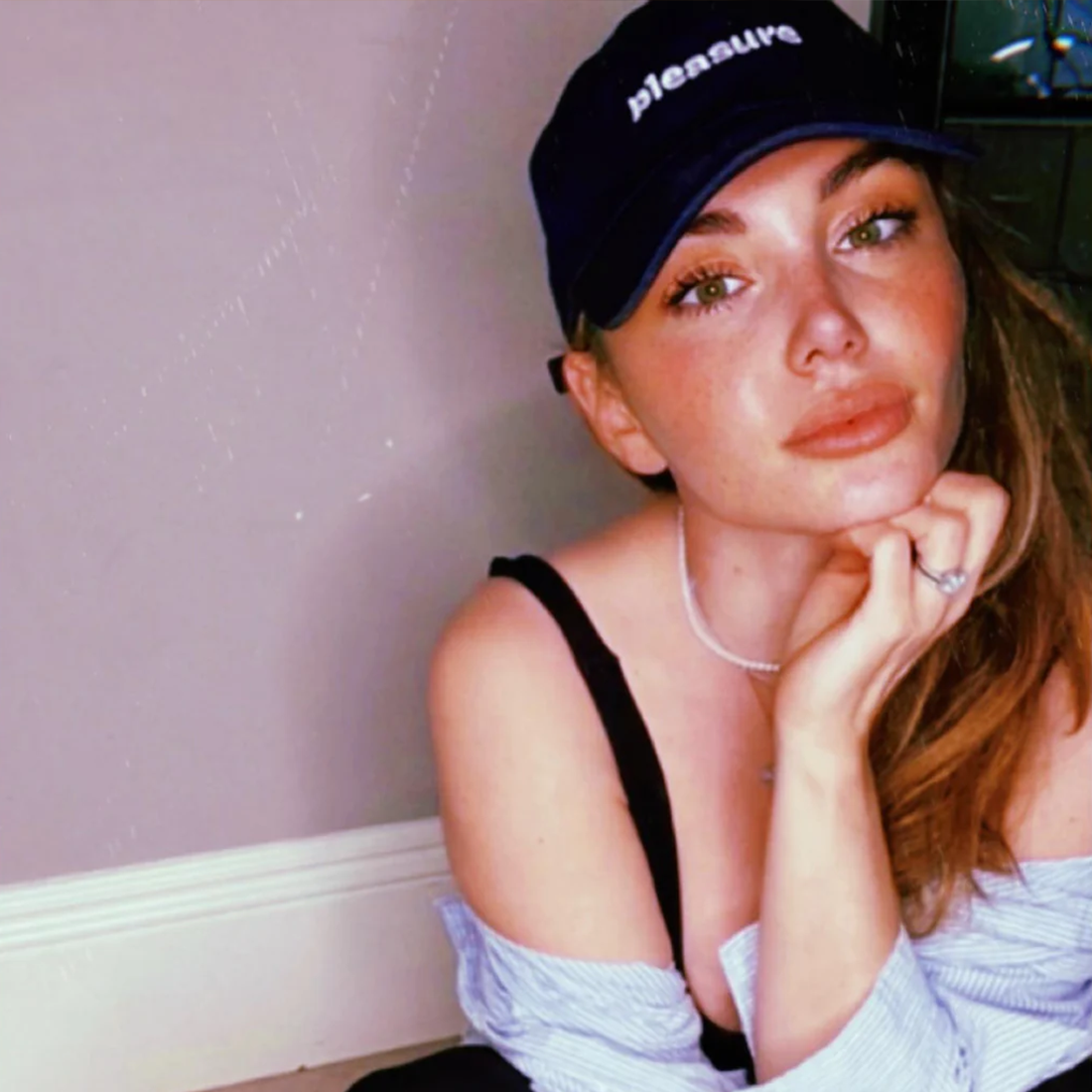 Navy blue cotton dad hat with "pleasure" embroidered on the front.
