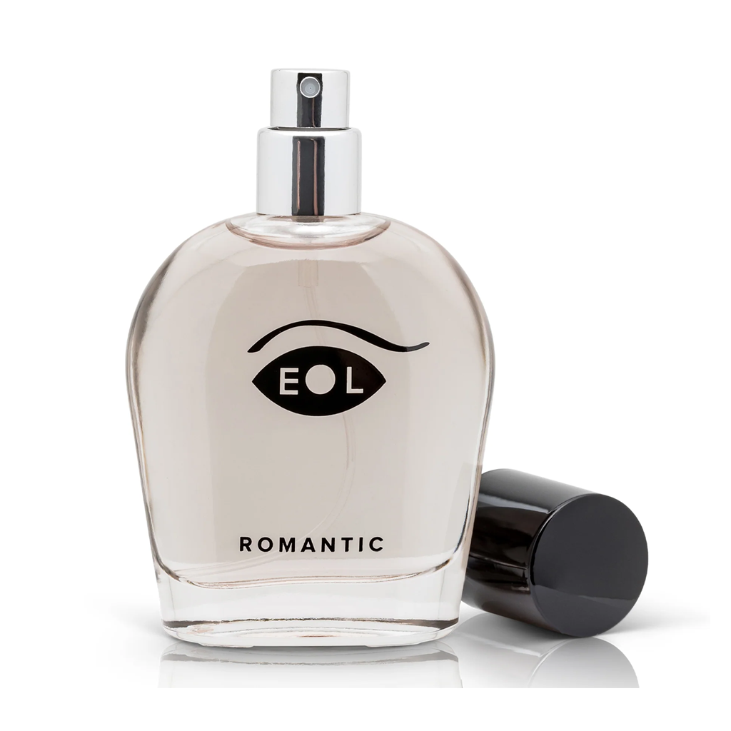 A clear glass bottle of Romantic EOL cologne with a black cap.