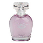 A clear glass perfume bottle with purple liquid and a faceted clear cap.