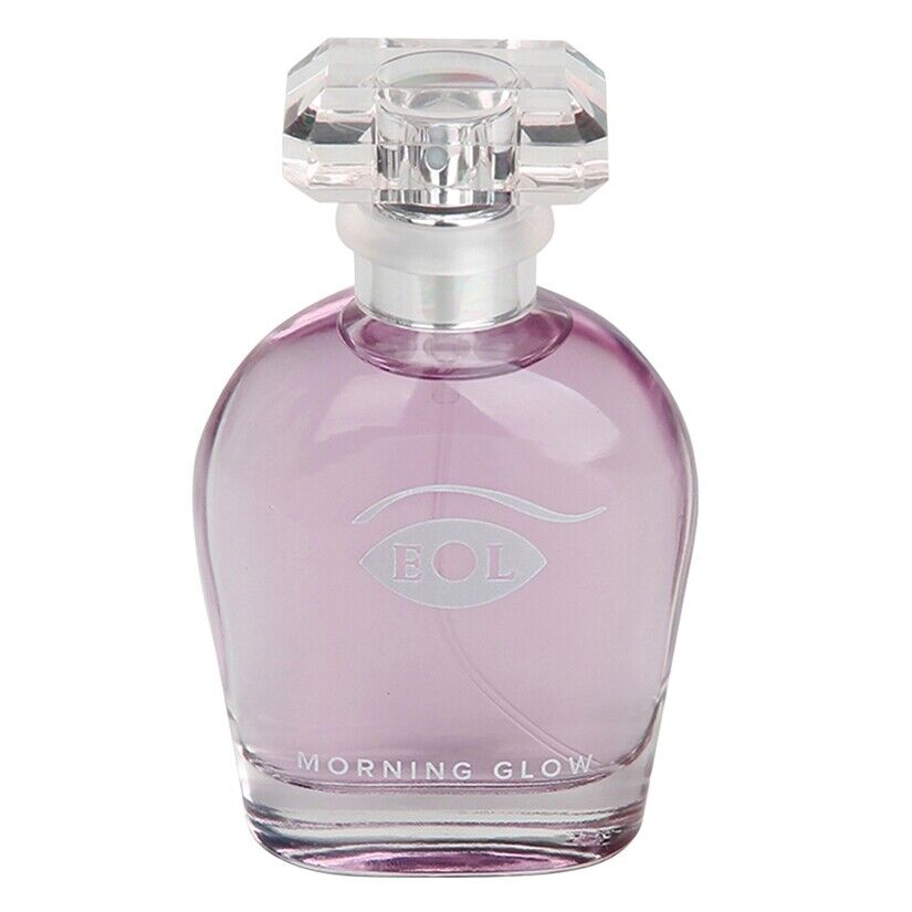A clear glass perfume bottle with purple liquid and a faceted clear cap.