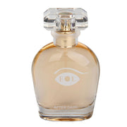 A clear glass perfume bottle with gold accents and a faceted cap, labeled "EOL AFTER DARK".