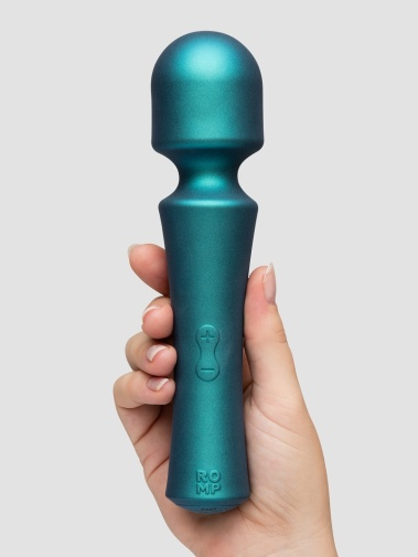 Teal mini wireless wand vibrator held in a hand with power buttons and brand name visible.