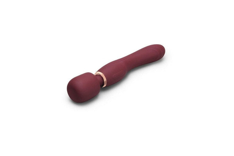 A maroon silicone wand massager with a rose gold ring.