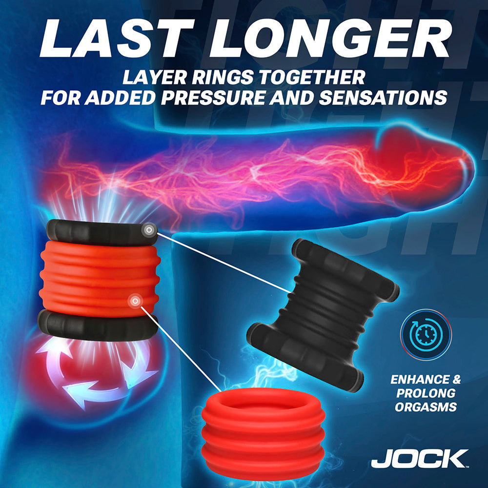 Silicone cock ring and ball stretcher set in red and black.