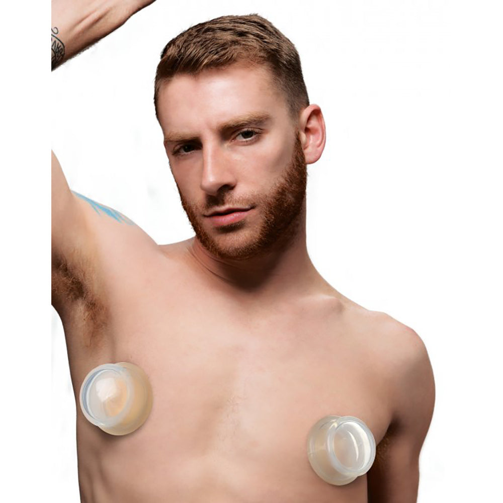 Clear silicone nipple suckers with a large opening.