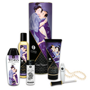Carnal Pleasures gift set with massage oil, lube, and other intimate products.